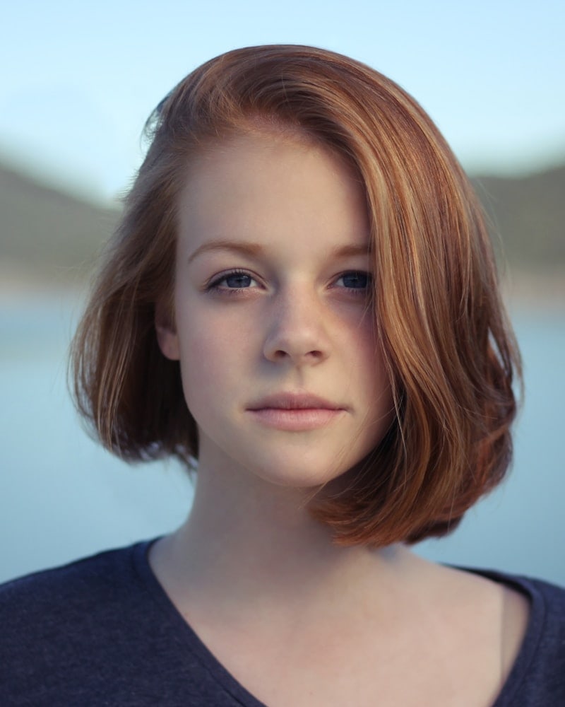 Portrait of Yasmin by the kitchen window in early light